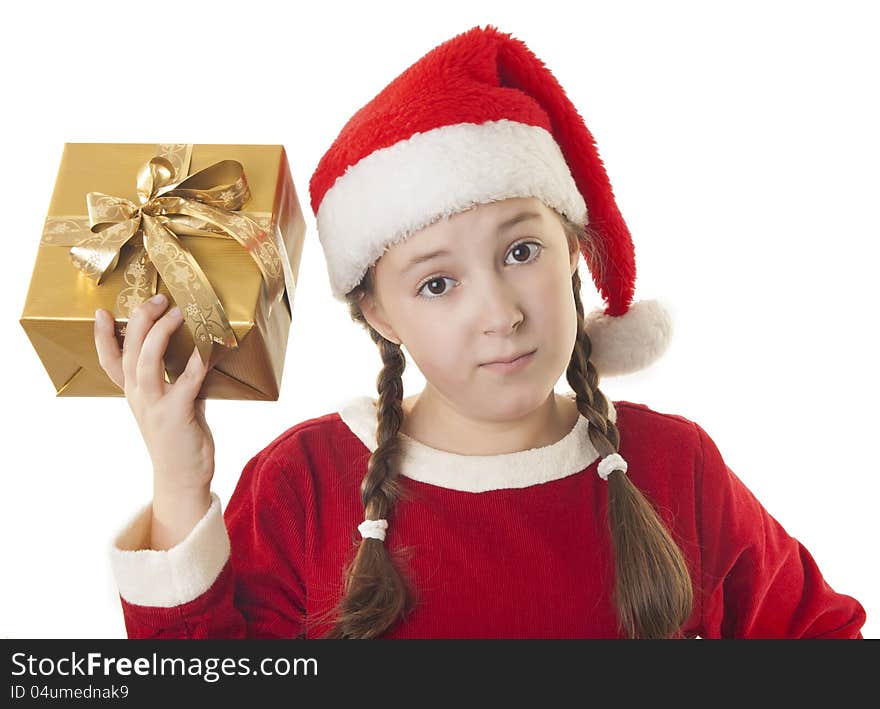 Beautiful girl dressed in Christmas clothes and red santa hat with present in her hand isolated on white background. Beautiful girl dressed in Christmas clothes and red santa hat with present in her hand isolated on white background