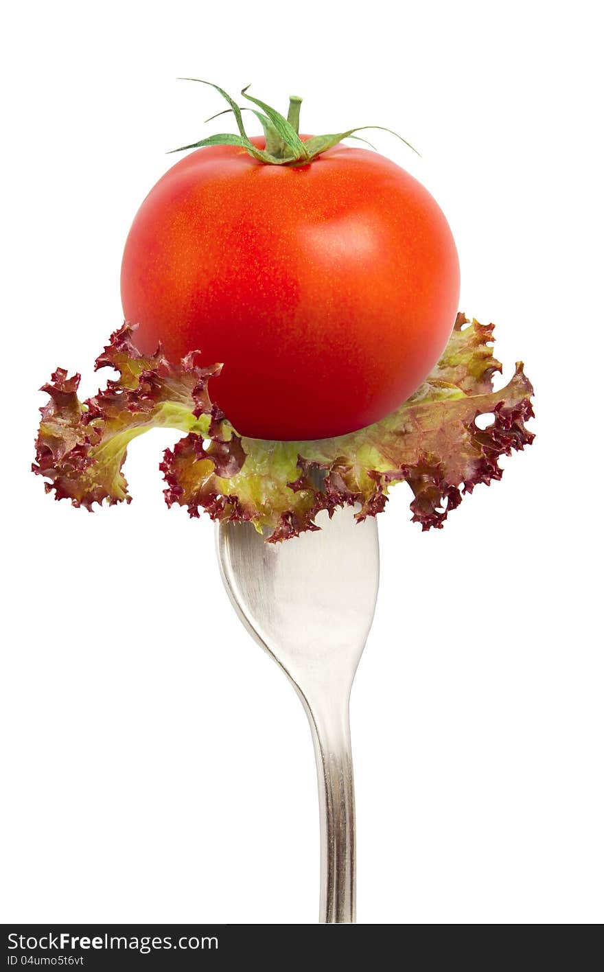 The fresh tomato on fork isolated at white background