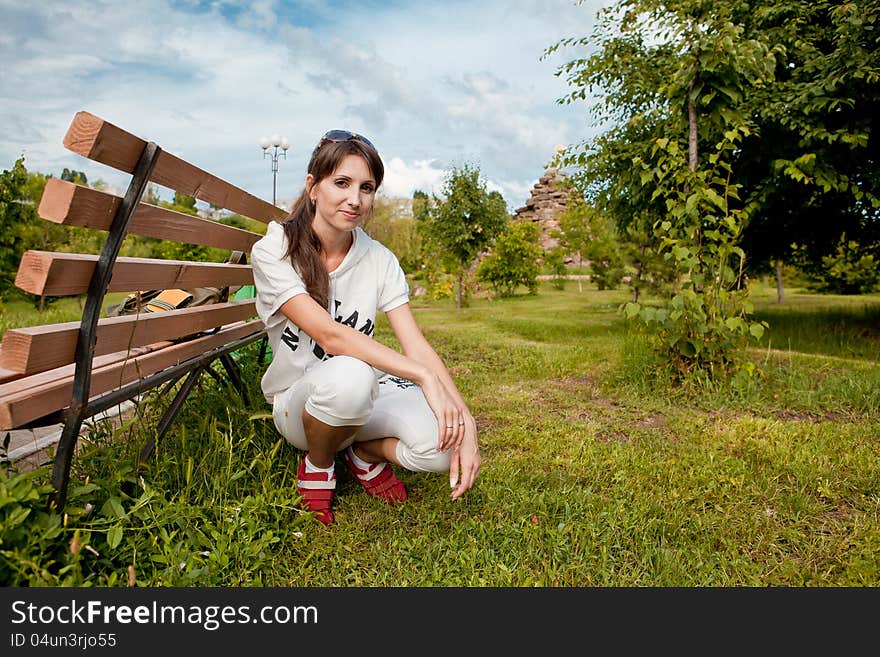 Beautiful woman portrait to the nature in black sunglasses. Beautiful woman portrait to the nature in black sunglasses