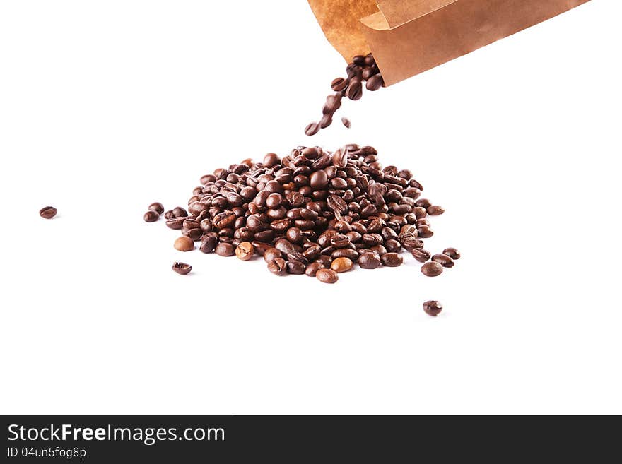 Paper bag with grain coffee on white background