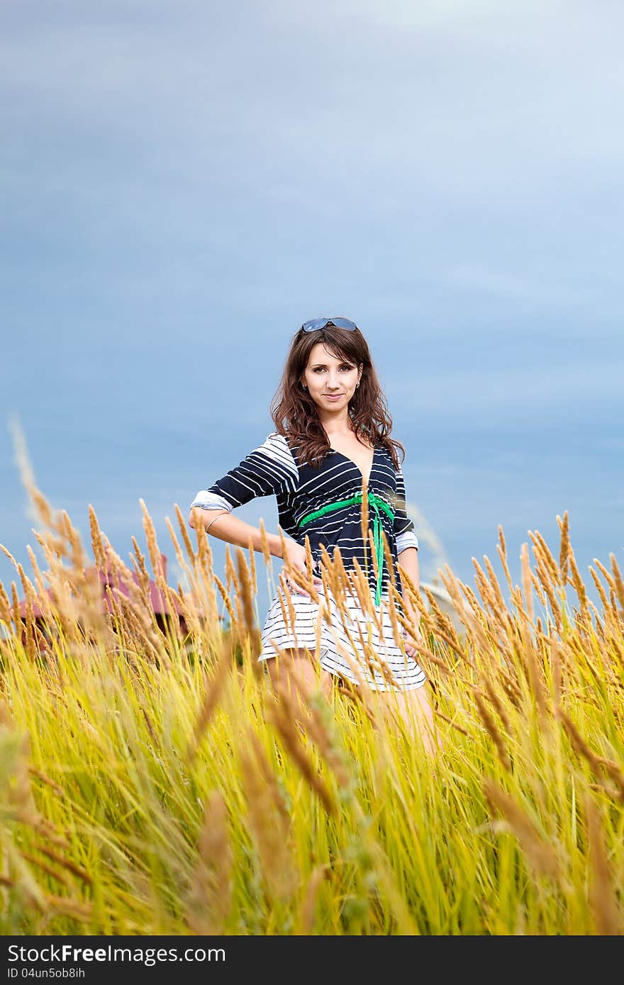 Happy young woman in a field