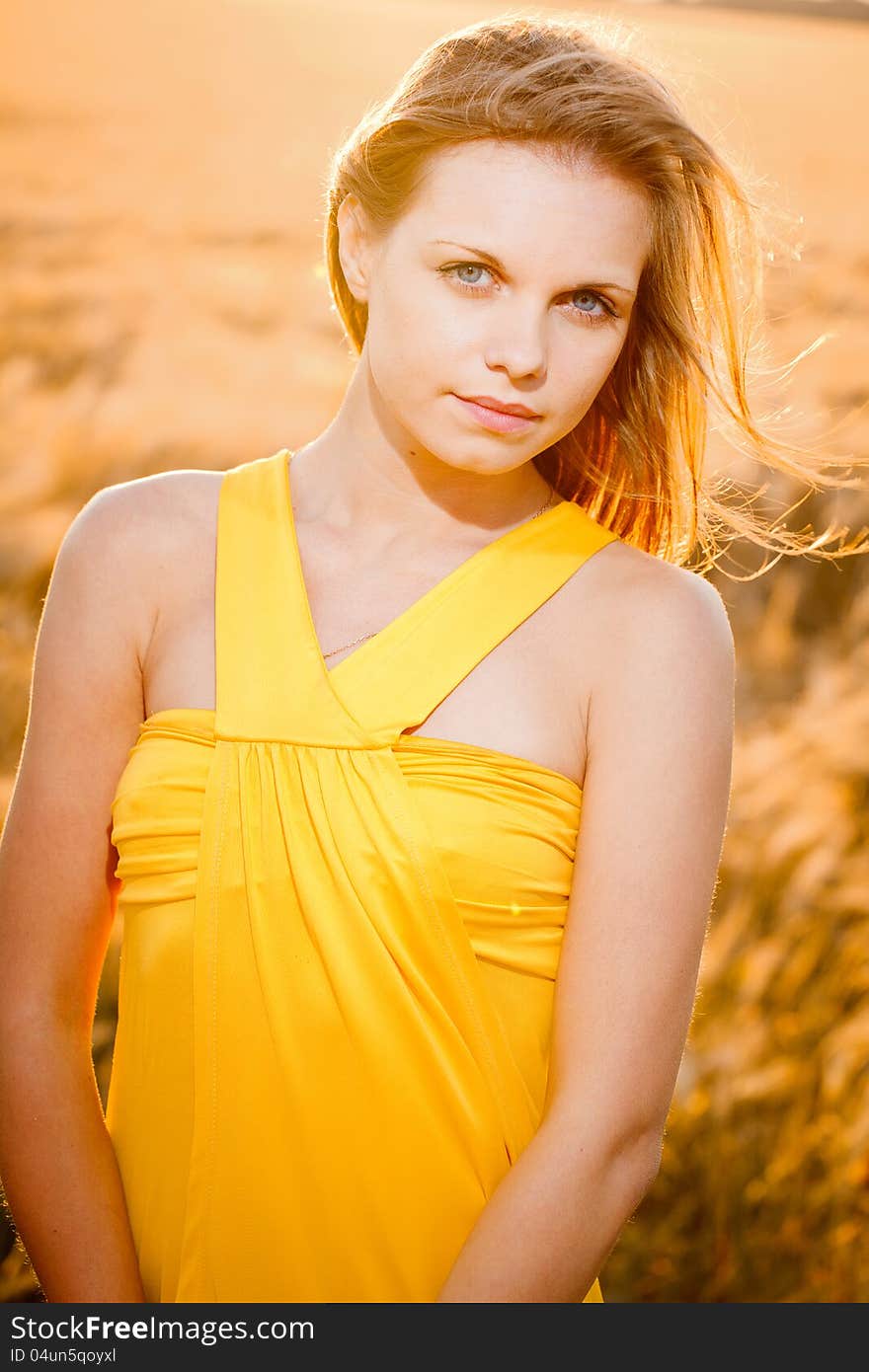 Portrait of a fresh and beautiful young fashion model posing outdoor in sunny weather. Portrait of a fresh and beautiful young fashion model posing outdoor in sunny weather