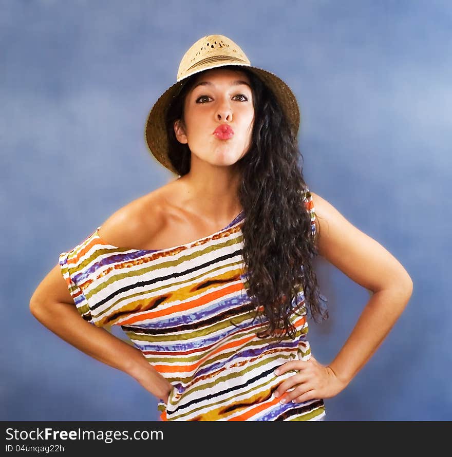 Beautiful latin young woman with shirt colors and hat. Beautiful latin young woman with shirt colors and hat