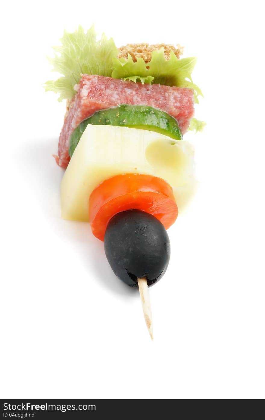 Single Canape with Lettuce, Salami, Tomatoes, Cheese, Cucumber,Black Olive, and Whole Grain Bread  on white background