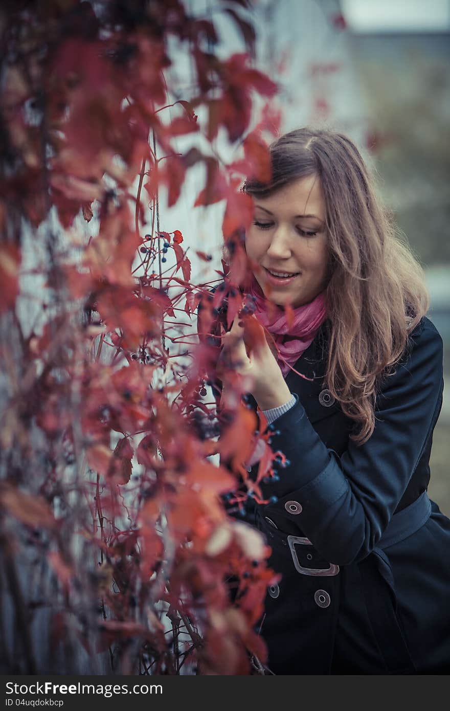 Girl with red leaves