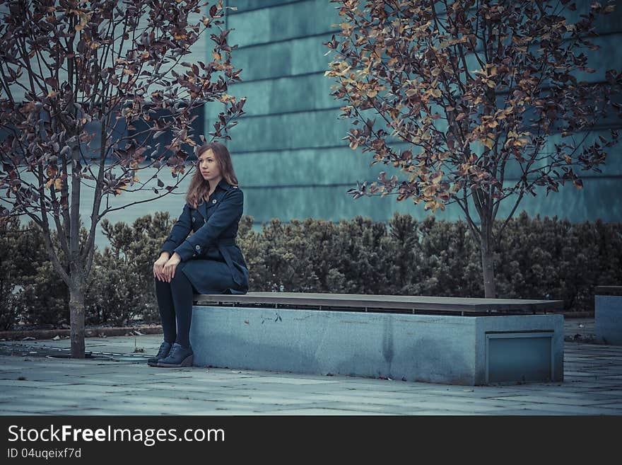 Girl sit strait on the bench. Girl sit strait on the bench