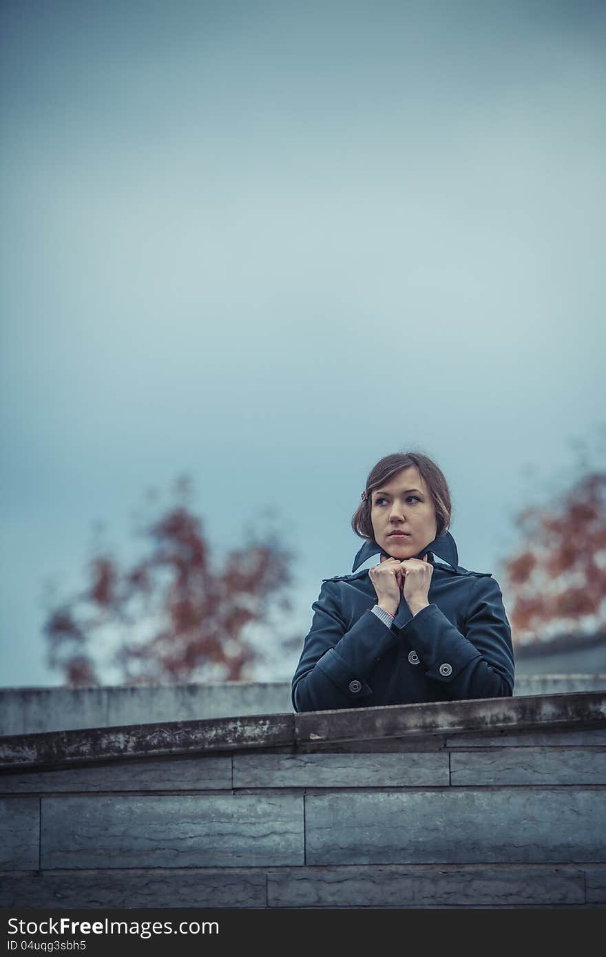 Girl waiting for someone on the cold weather