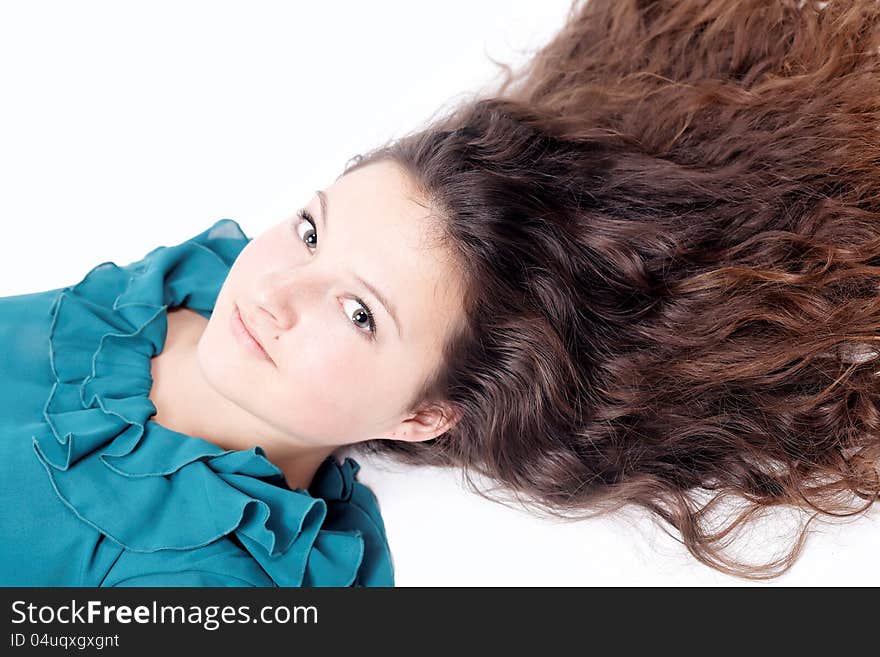 Pretty girl with long curly hair isolated