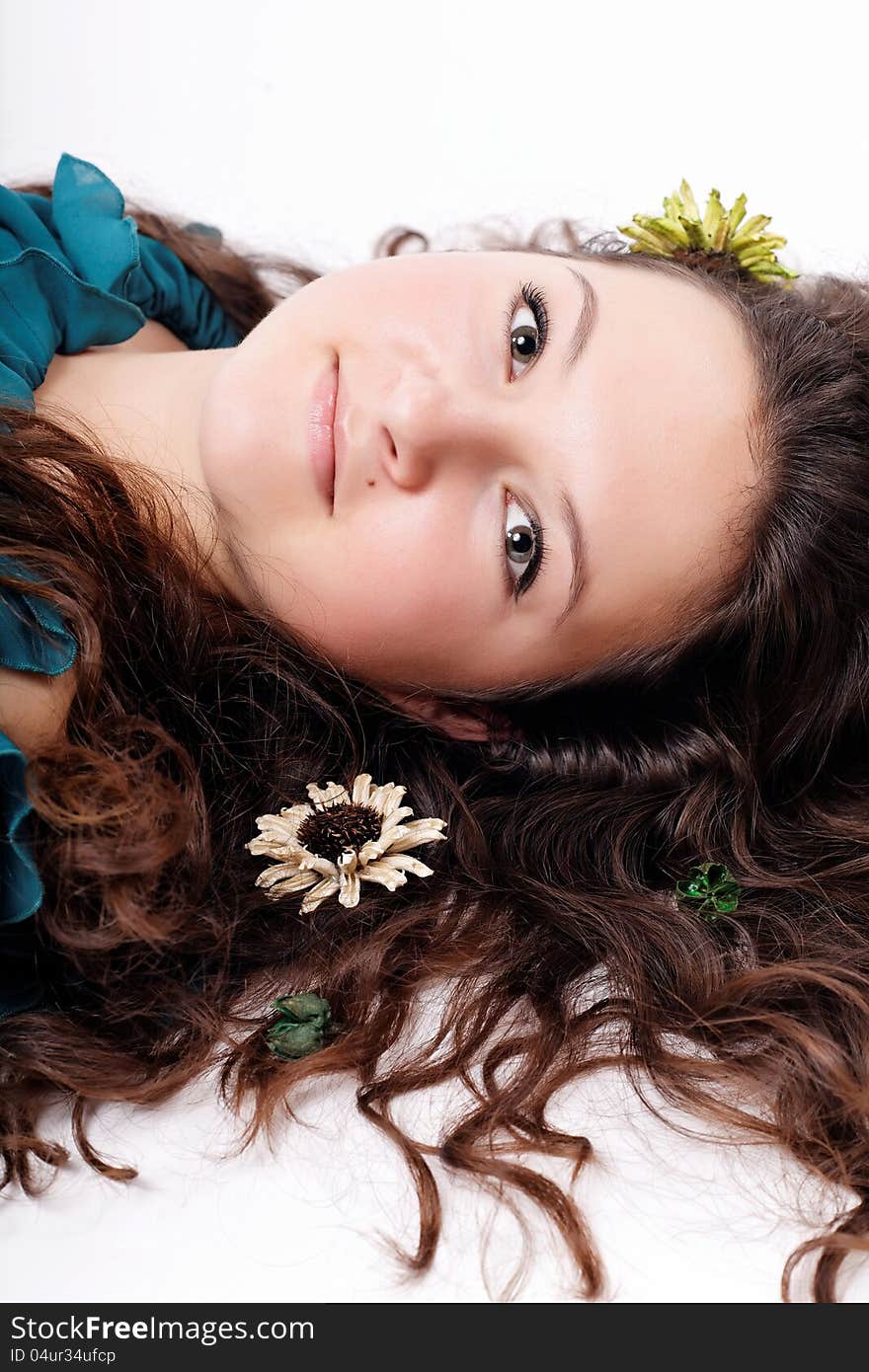 Portrait Of Brunette Girl With Flowers