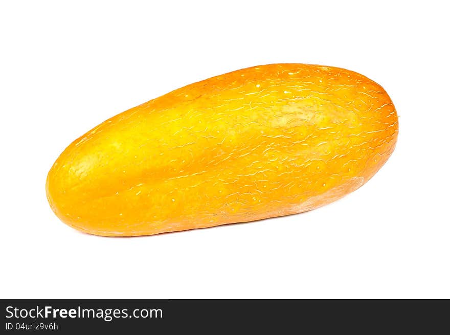 A large overripe yellow cucumber on white background