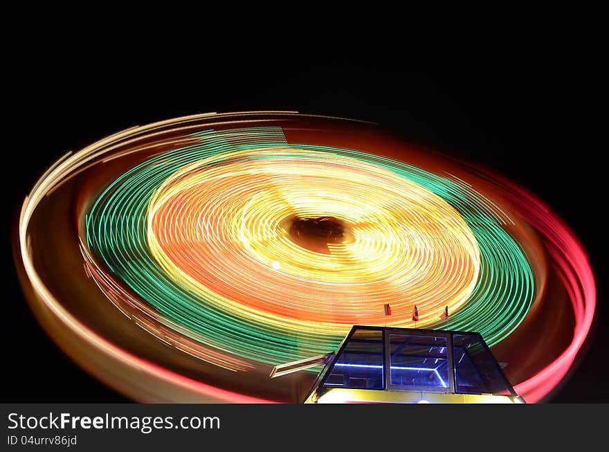 A merry-go-round in an amusement park. A merry-go-round in an amusement park