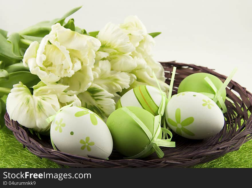 Easter basket with eggs and tulips. Easter basket with eggs and tulips