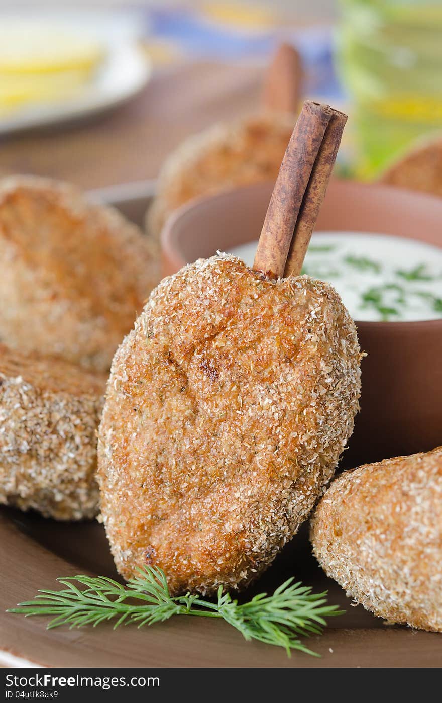 Chicken cutlets on a stick of cinnamon