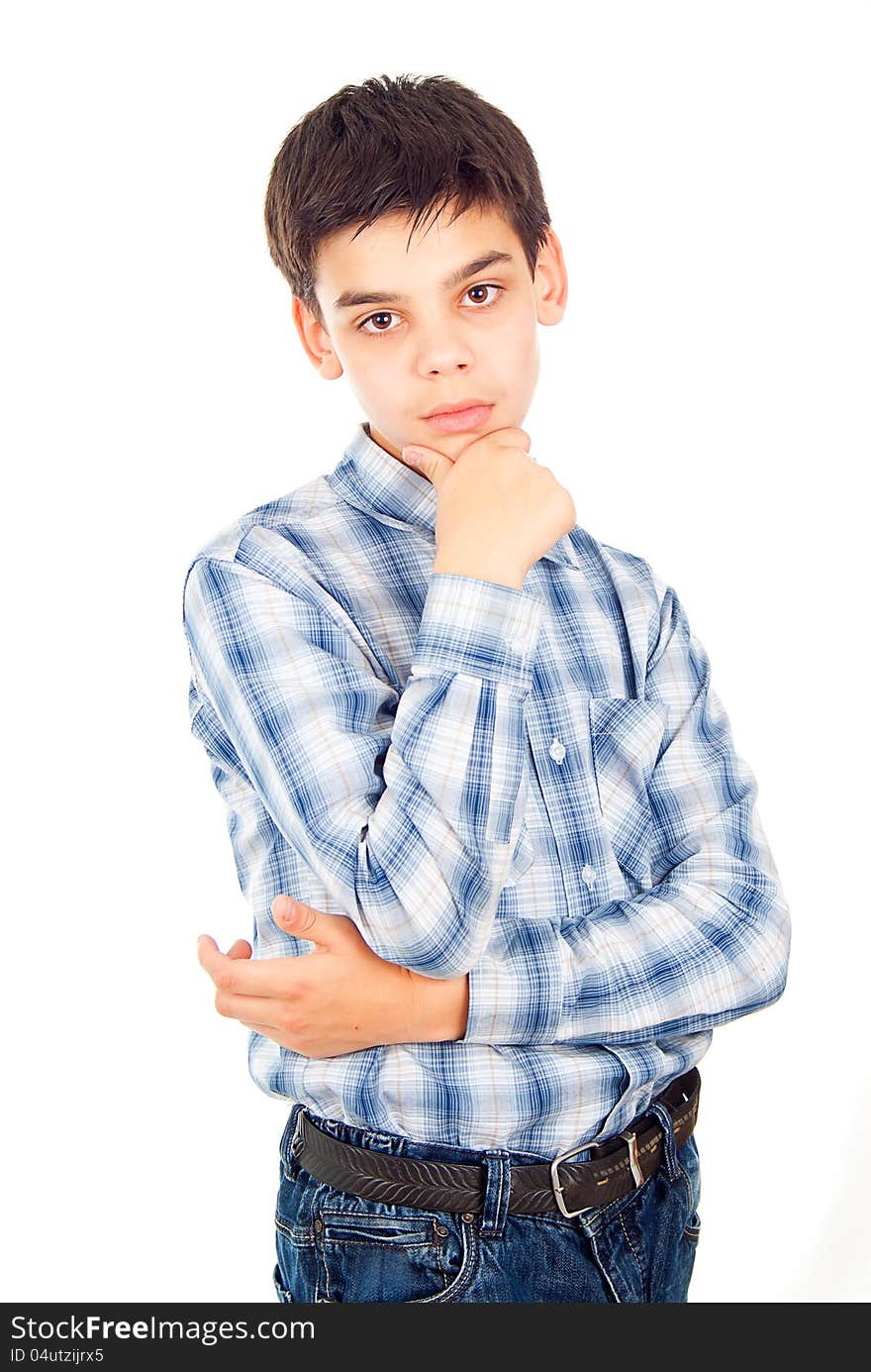 Handsome boy in a shirt stands isolated