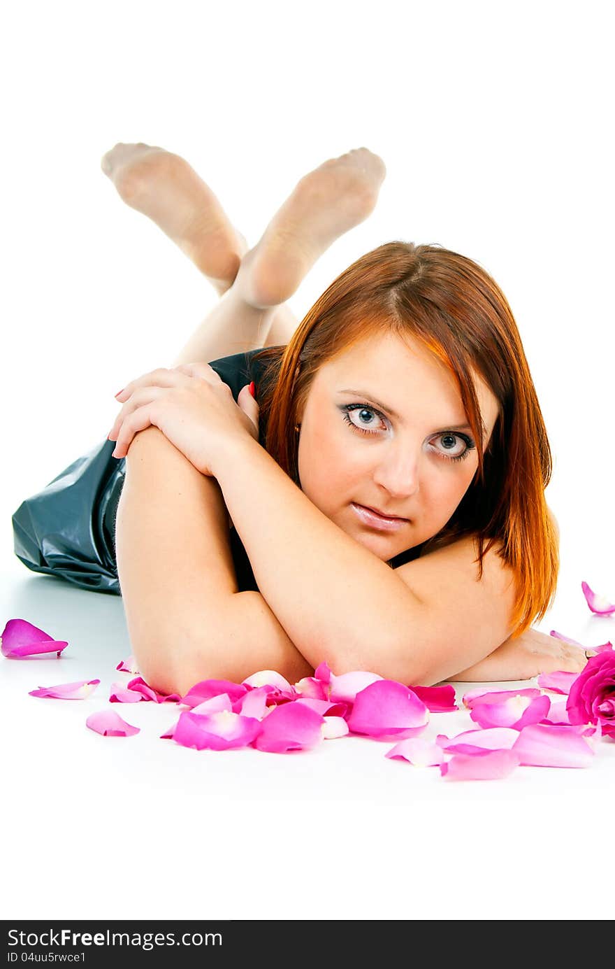 Portrait of girl with petals of roses