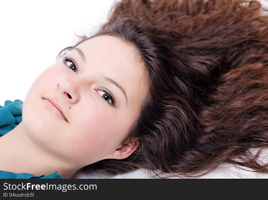 Portrait of brunette girl on an isolated white background