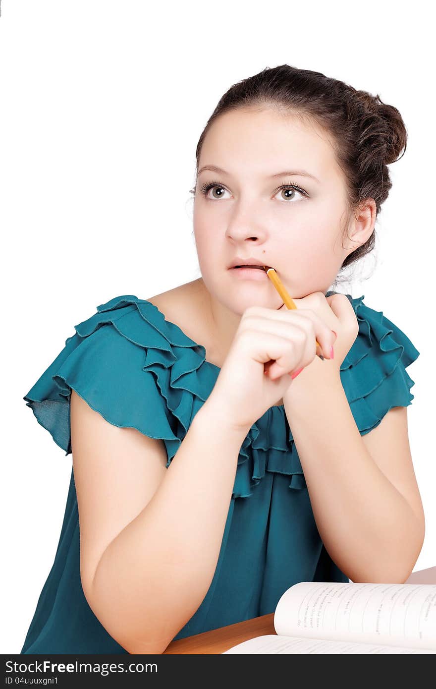 Pretty  schoolgirl thought on isolated white background. Pretty  schoolgirl thought on isolated white background