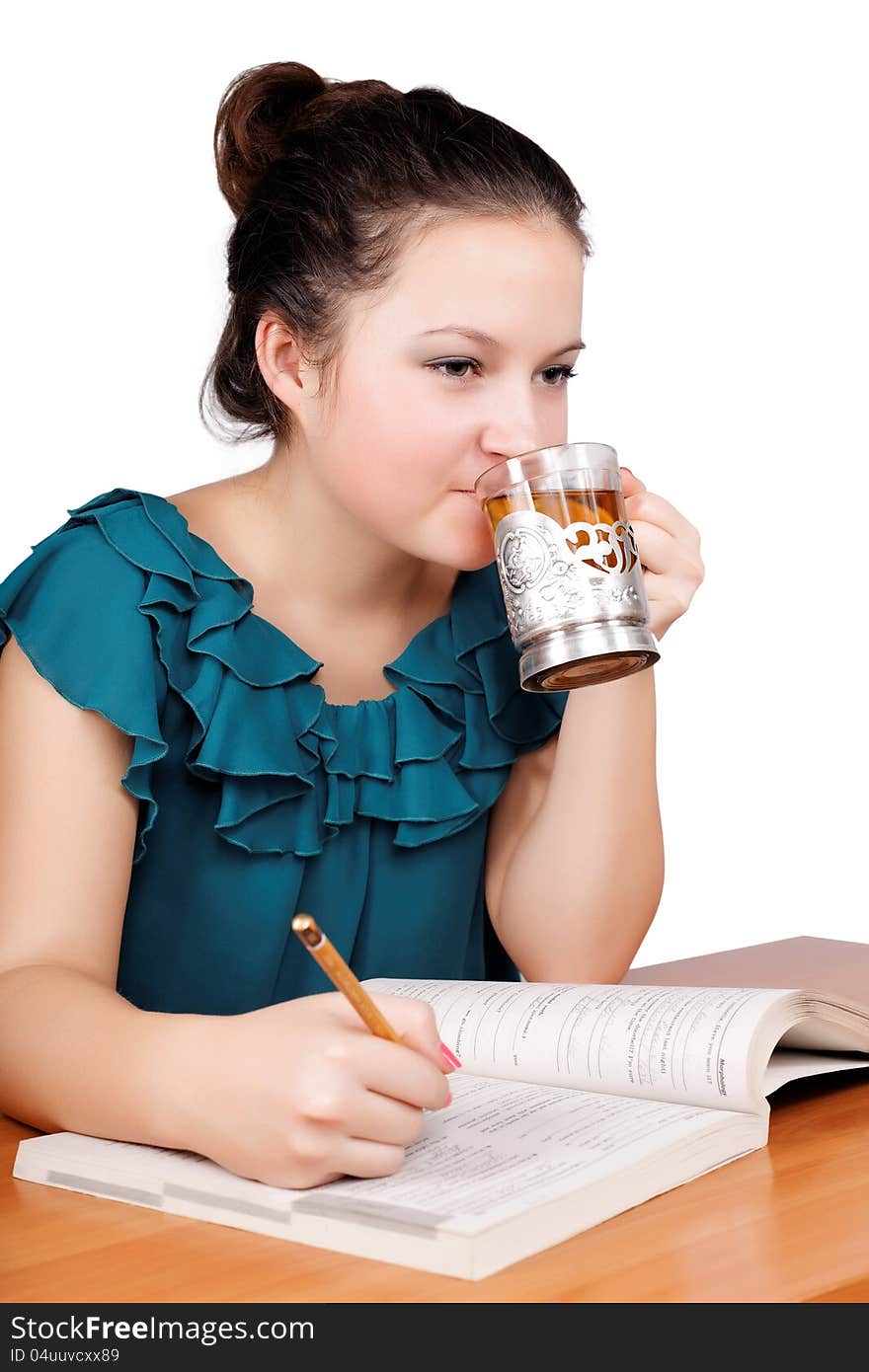 Pretty schoolgirl drinking tea