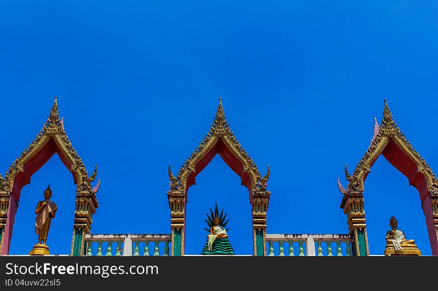 Thai art, Buddha images on roof top of building in temple, Phuket, Thailand