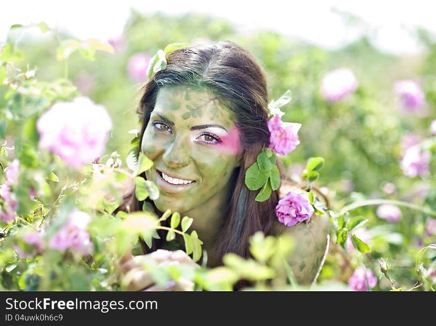 Beautiful girl in a rose field. Beautiful girl in a rose field