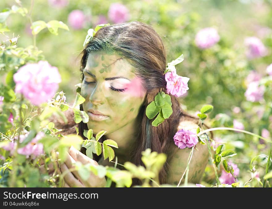 Girl standing in rose field. Girl standing in rose field