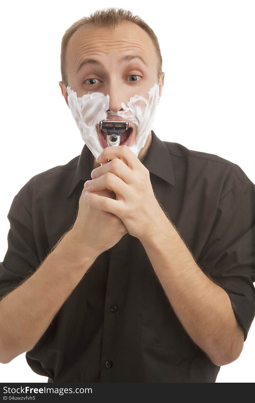 Man with shaver  and foam on face having fun against pure white background. Man with shaver  and foam on face having fun against pure white background