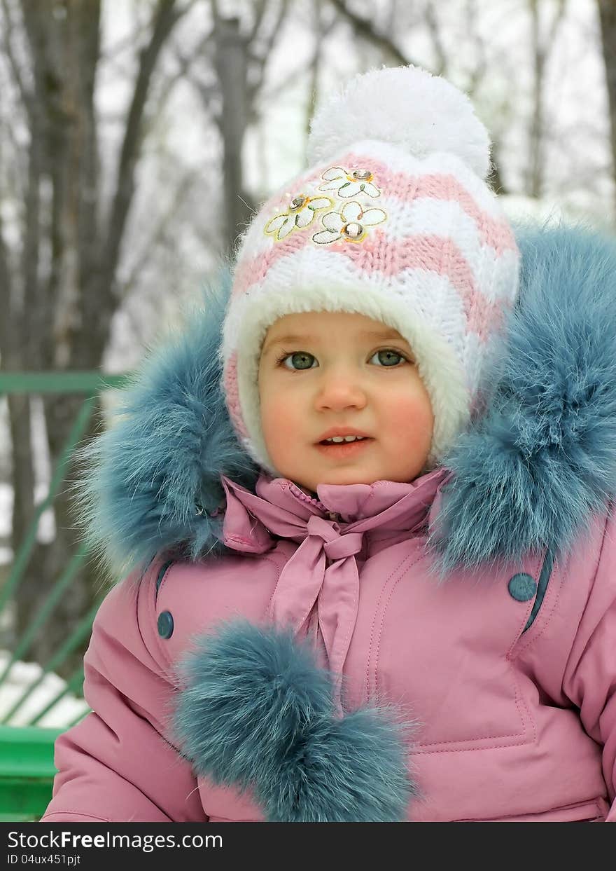 Baby in warm clothes for a walk. Baby in warm clothes for a walk