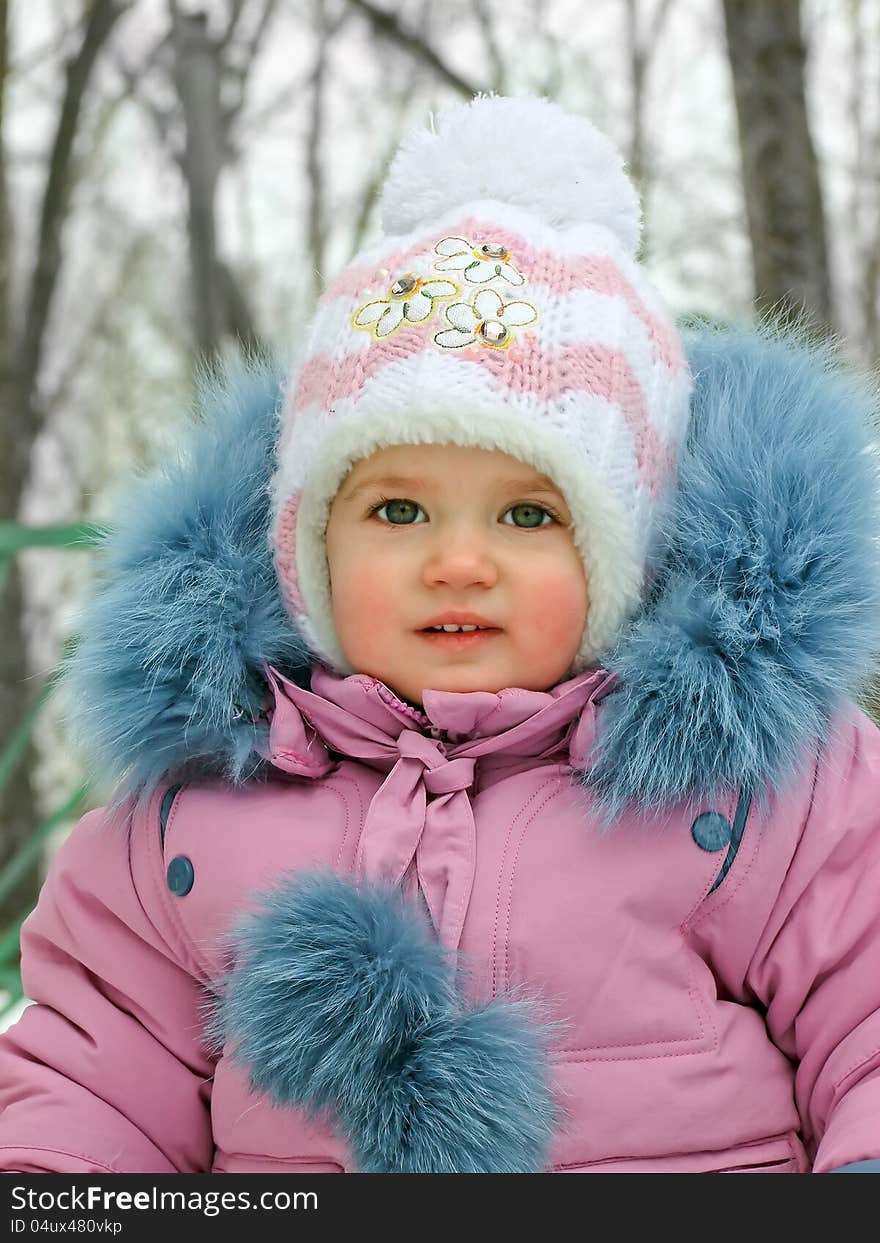 Baby in warm clothes for a walk. Baby in warm clothes for a walk