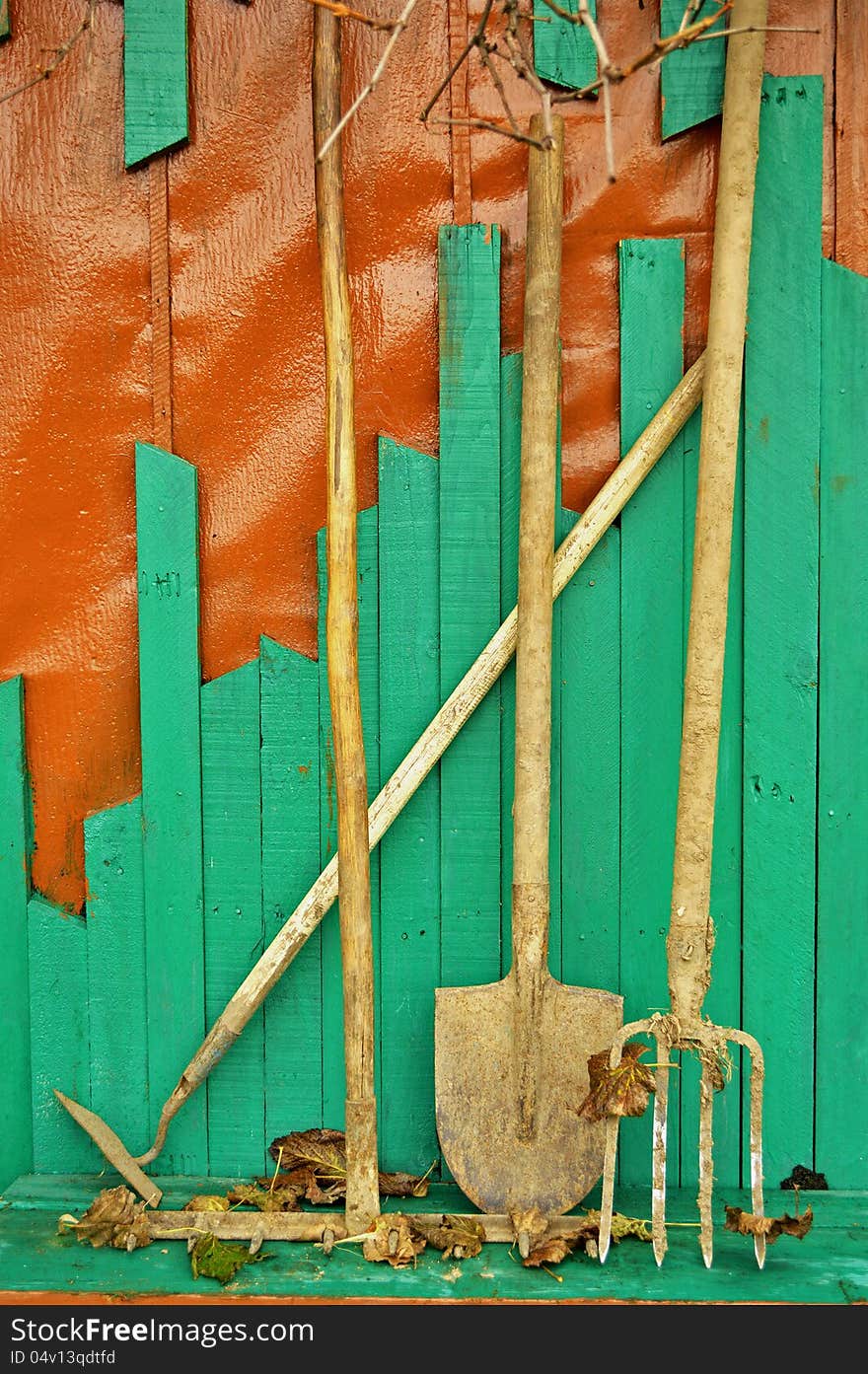 Garden tools on the green background