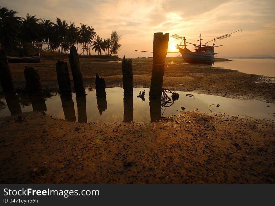 Stumps and boat for catching squid in the evening [2] .Waiting for the water to rise.Thailand,. Stumps and boat for catching squid in the evening [2] .Waiting for the water to rise.Thailand,