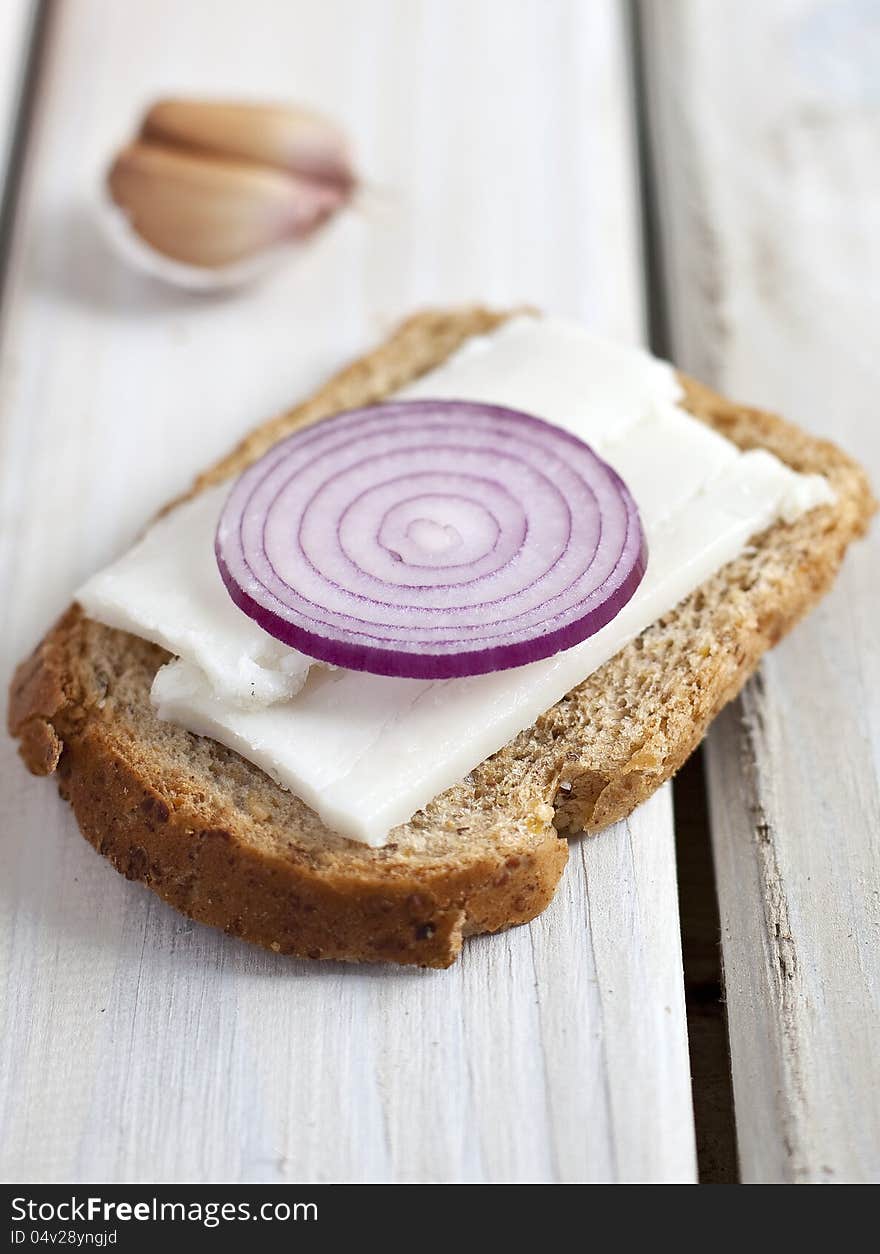 Slice of bread with lard and red onion. Slice of bread with lard and red onion