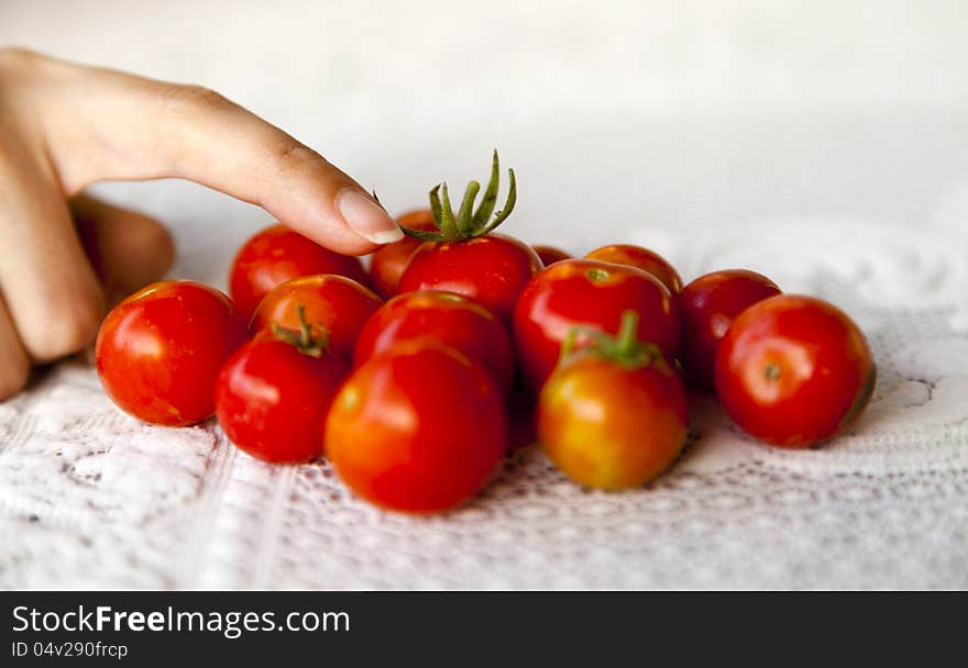 Finger pointing tomatoes