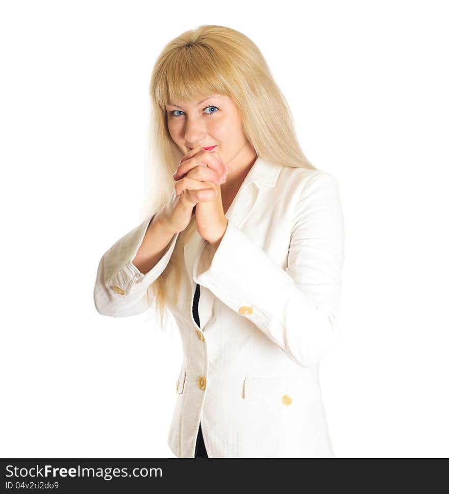 Woman in a white coat holds a hand with crossed fingers on white background isolated