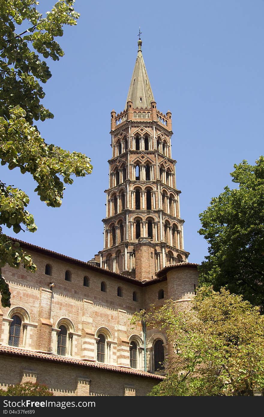 The famous spire of the Romanesque church built in the French city around 1100. The famous spire of the Romanesque church built in the French city around 1100