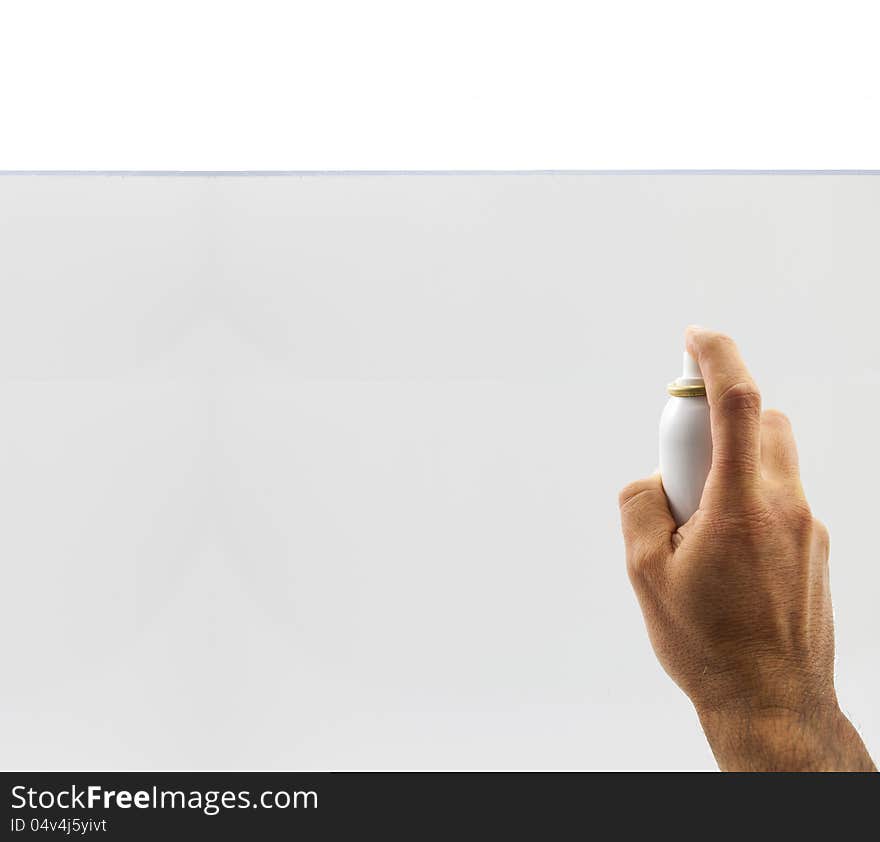 Hand holding spray can over white background. Hand holding spray can over white background