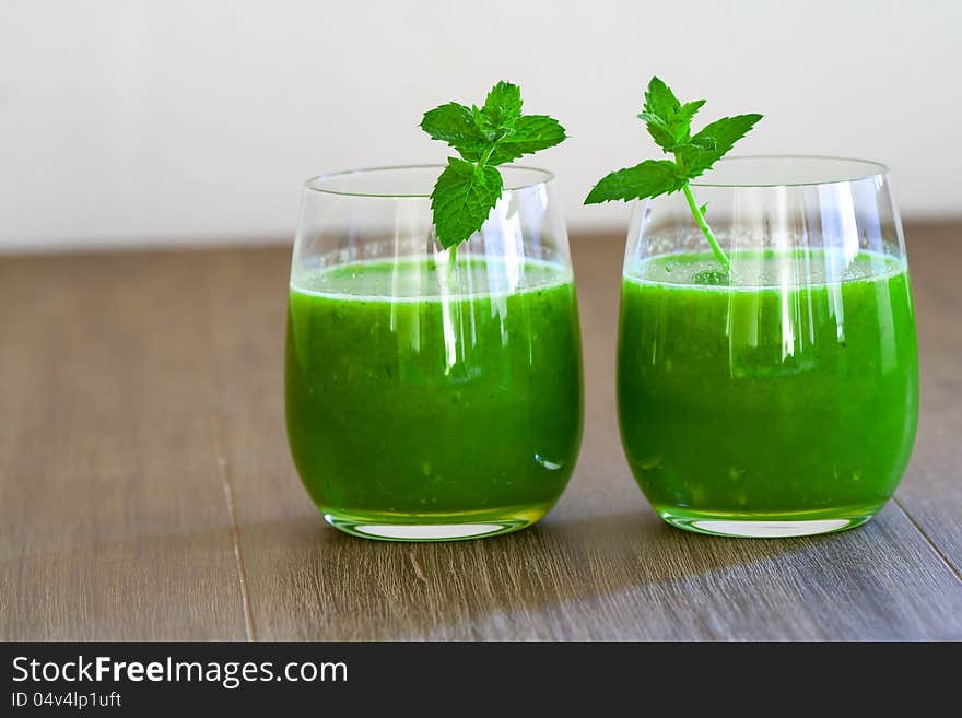 Two glasses of healthy wheat grass juice. Two glasses of healthy wheat grass juice