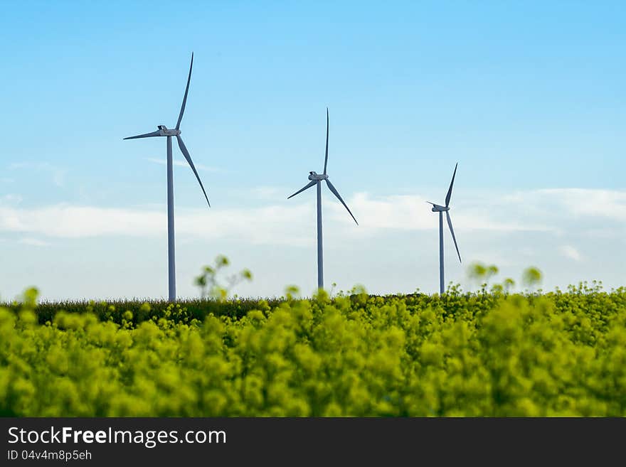 Three wind turbines in a row