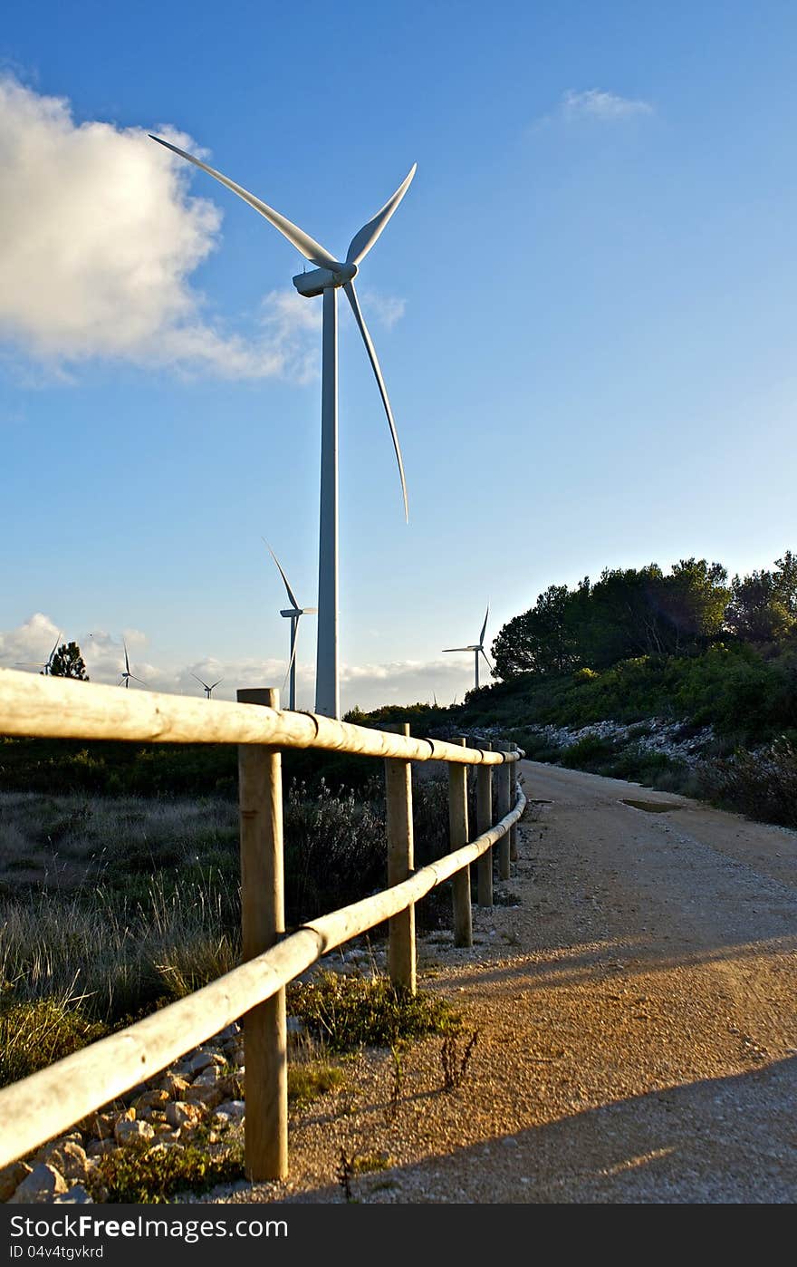 Modern wind energy park park. Eolic generator in the mountain.