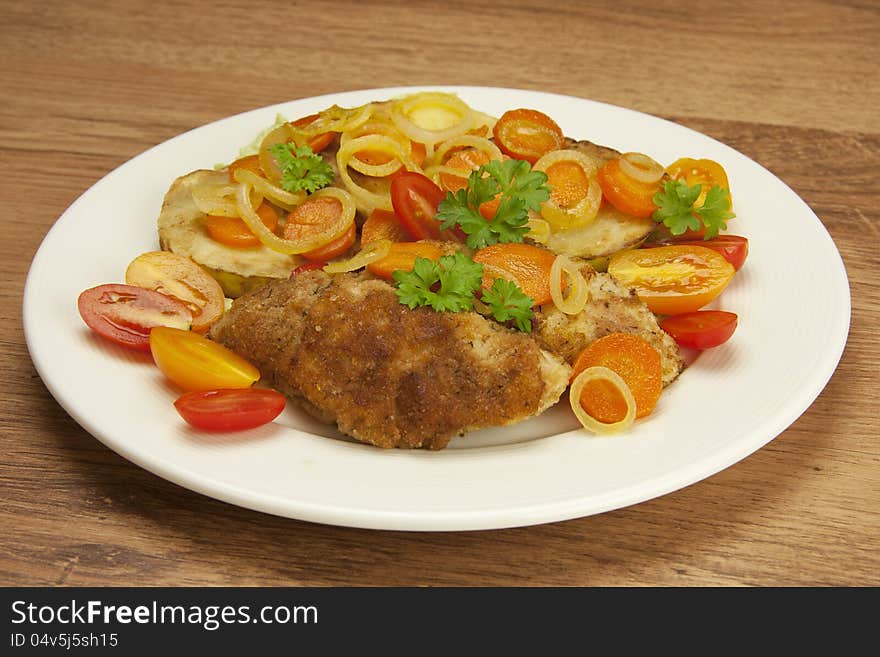 Fried chicken fillets with stewed vegetables