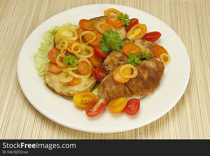 Fried chicken fillets with stewed vegetables