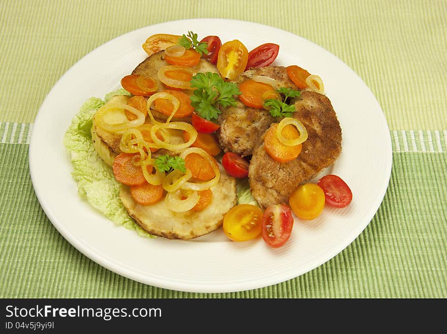 Fried chicken fillets with stewed vegetables