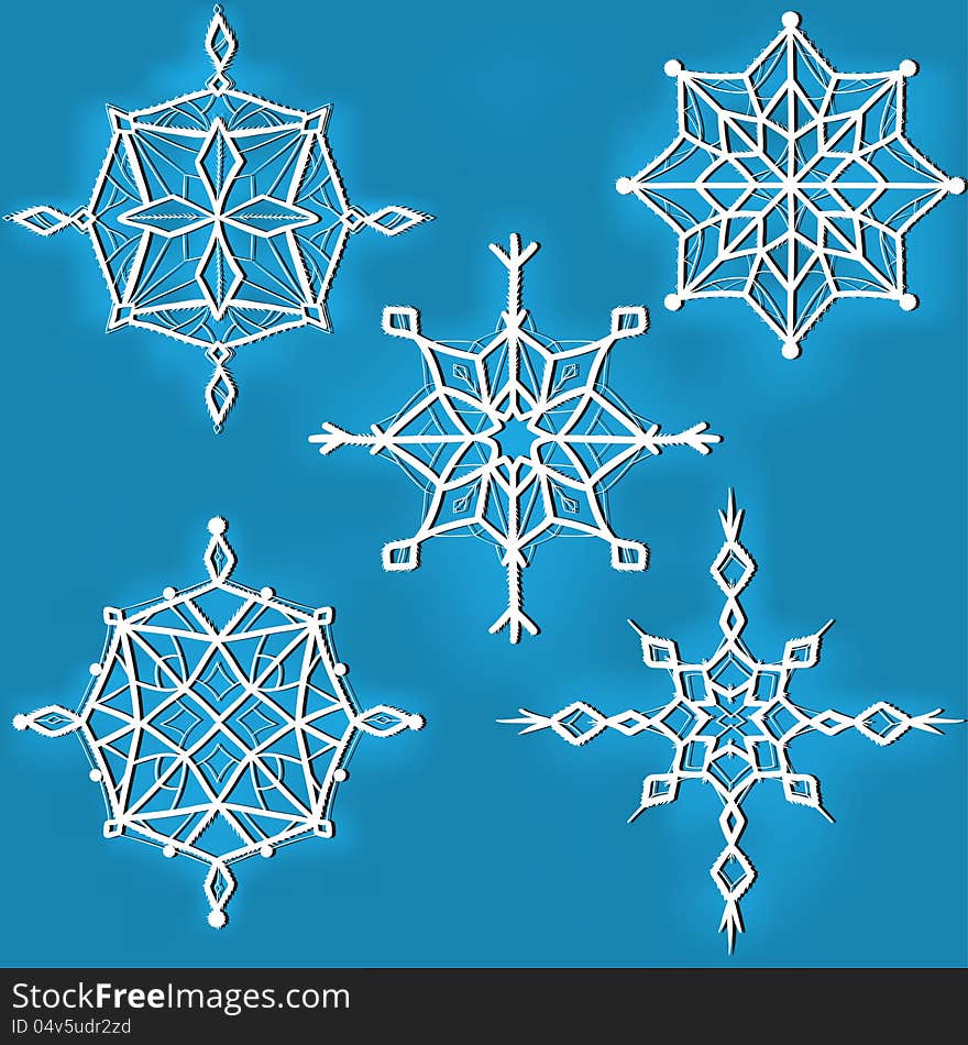 Set Of Ornate Snowflakes Against Blue Background