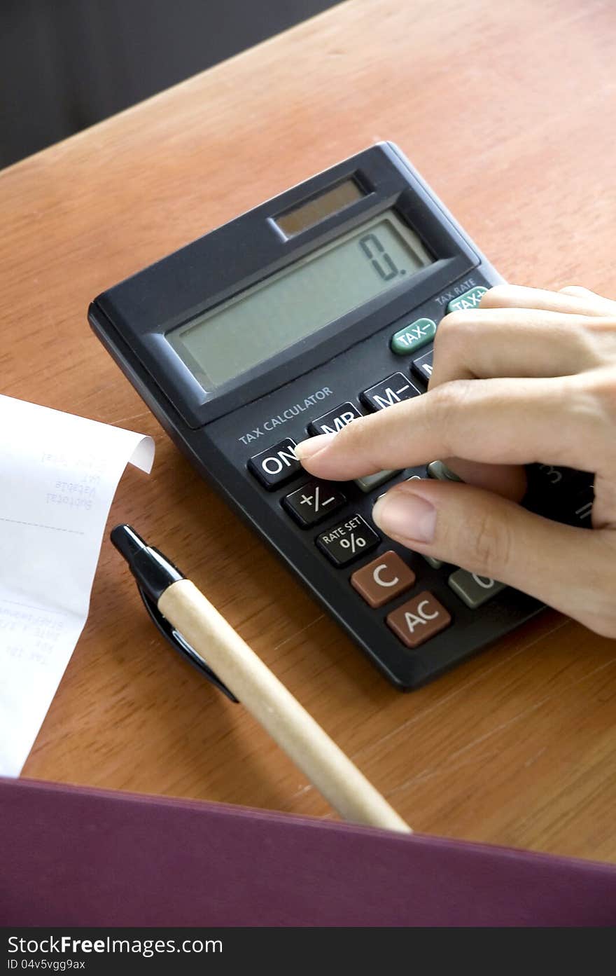 Woman's hand open on calculator. Woman's hand open on calculator