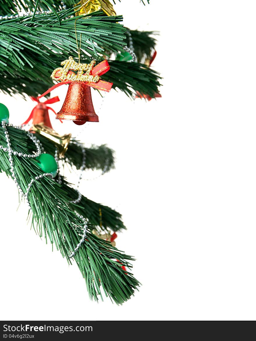 Christmas bell and new year beads on the branch of a tree on a white background