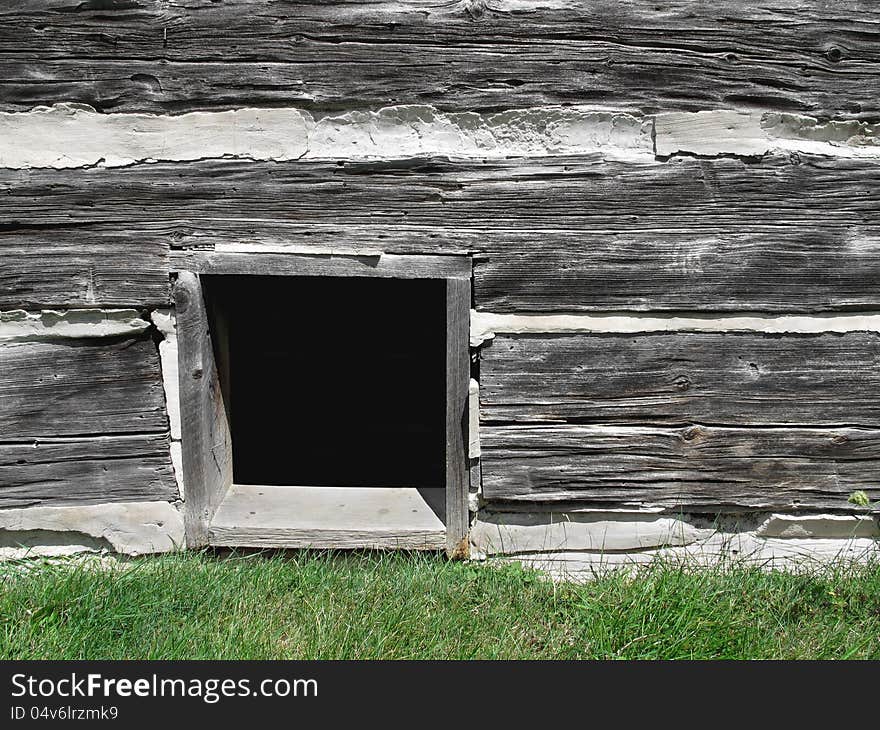 Basement Window In Old Log Building.