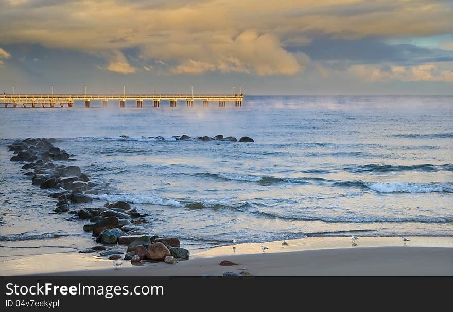 Colorful sunrise at marine pier in Palanga, Lithuania, Europe