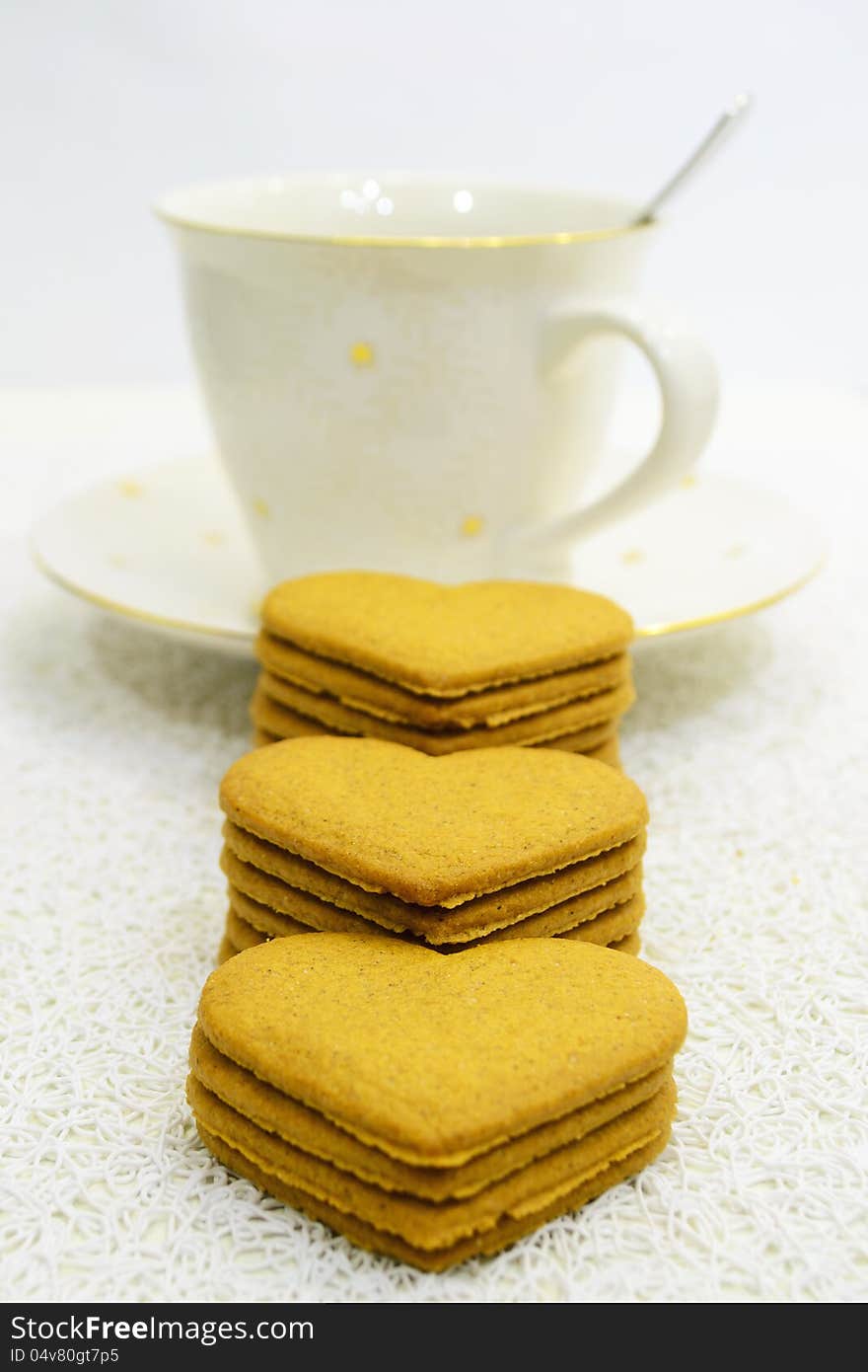 Big cup of black coffee and pile of ginger-breads. Big cup of black coffee and pile of ginger-breads