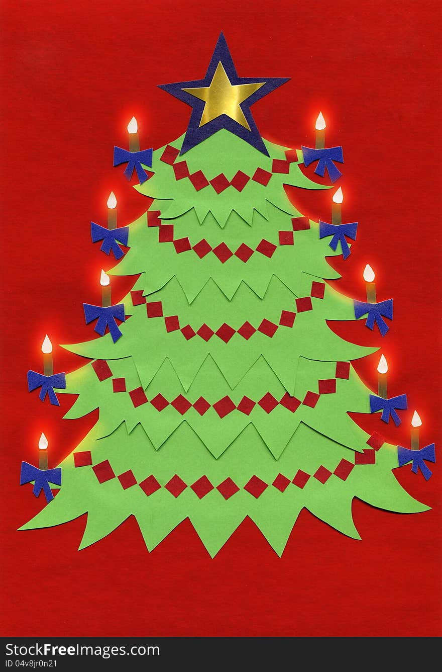 The paper cutout of christmas tree with candles