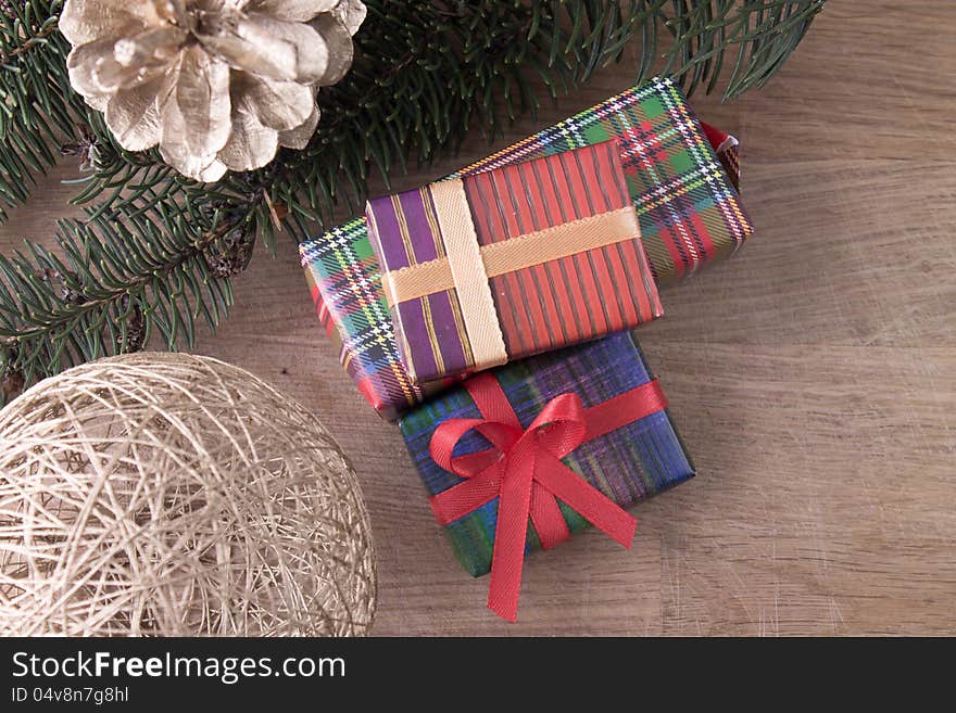 Christmas decoration with gifts on old wood background. Christmas decoration with gifts on old wood background