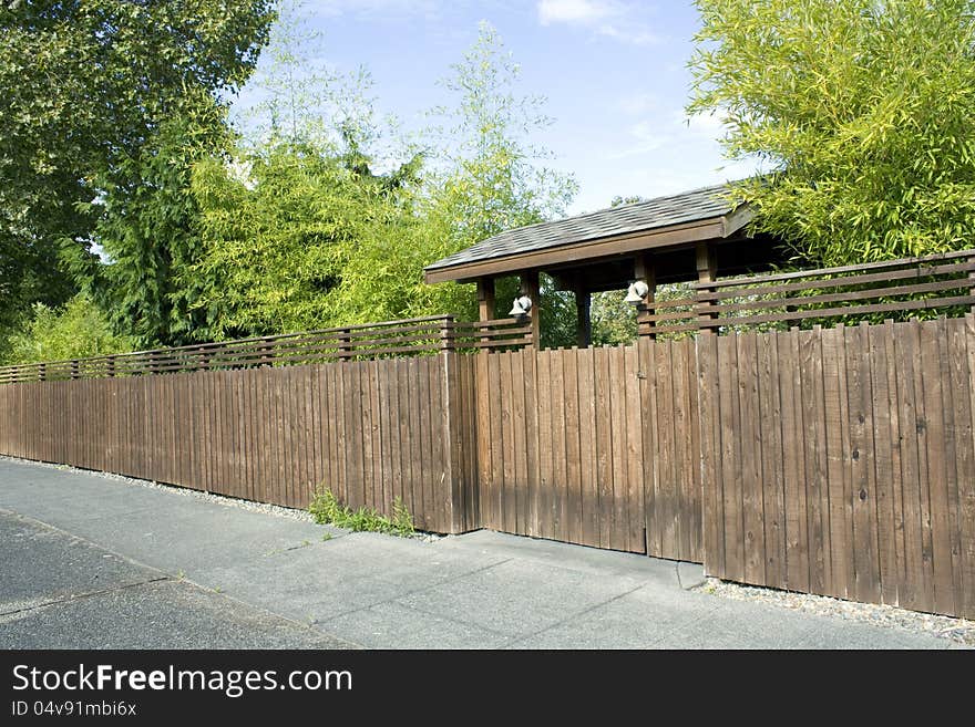 Wooden fence, gate and bamboo